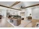 Open-concept living room with hardwood floors and seamless flow into the modern kitchen at 8638 Scottish Troon Ct, North Charleston, SC 29420