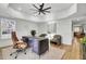 Spacious home office with modern desk, comfortable seating, and plenty of natural light at 8638 Scottish Troon Ct, North Charleston, SC 29420