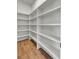 Spacious walk-in pantry with ample shelving for organized storage at 8638 Scottish Troon Ct, North Charleston, SC 29420