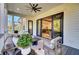 Relax on the outdoor patio near large sliding doors and views of the kitchen and living room beyond at 8638 Scottish Troon Ct, North Charleston, SC 29420