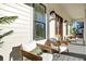 Inviting porch with comfortable seating, perfect for relaxing and enjoying the outdoors at 8638 Scottish Troon Ct, North Charleston, SC 29420