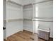 Walk-in closet with custom shelving and ample storage space, perfect for organization at 8638 Scottish Troon Ct, North Charleston, SC 29420