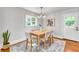 Charming dining room featuring a wooden table, upholstered chairs, and a stylish light fixture at 914 S Main St, Summerville, SC 29483