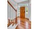 Entryway featuring hardwood floors, white trim, and a wooden front door with sidelights at 914 S Main St, Summerville, SC 29483