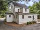 A view of the home's side, complete with a driveway and mature landscaping at 914 S Main St, Summerville, SC 29483