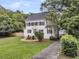 A charming residence featuring a well-manicured lawn and convenient driveway to garage at 914 S Main St, Summerville, SC 29483