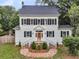 Charming two-story home featuring classic shutters, brick walkway, and landscaped front yard at 914 S Main St, Summerville, SC 29483