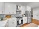 Stylish kitchen featuring white cabinets, stainless steel appliances, and marble countertops at 914 S Main St, Summerville, SC 29483