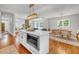 Open-concept kitchen flows into the dining room, featuring a kitchen island with seating at 914 S Main St, Summerville, SC 29483