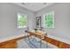 Bright home office with a stylish desk, natural light, and hardwood floors at 914 S Main St, Summerville, SC 29483