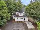 A view of the back of the house shows the patio and driveway at 914 S Main St, Summerville, SC 29483