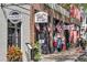 Charming storefronts featuring Madre's Mexican Restaurant and Train Town Toy & Hobby with American flags at 914 S Main St, Summerville, SC 29483