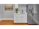Stylish wet bar with a stainless steel refrigerator, marble countertop, and ample cabinet space at 914 S Main St, Summerville, SC 29483