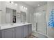Bathroom featuring double sinks, a glass-enclosed shower, and modern fixtures at 9700 Flooded Field Drive Dr, Ladson, SC 29456