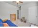 Neutral bedroom with a blue futon, offering a versatile space for relaxation or study with a doorway at 9700 Flooded Field Drive Dr, Ladson, SC 29456
