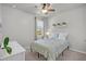 Calm bedroom with soft light, complemented by fresh greenery and a serene window view, creating a peaceful retreat at 9700 Flooded Field Drive Dr, Ladson, SC 29456