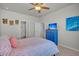 Bedroom featuring a ceiling fan, stylish bedding, and a large dresser at 9700 Flooded Field Drive Dr, Ladson, SC 29456