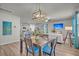 Open-concept dining area with stylish wooden table and a great view of the living room at 9700 Flooded Field Drive Dr, Ladson, SC 29456