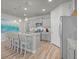 Bright kitchen featuring stainless steel appliances, granite countertops, and an island with bar seating at 9700 Flooded Field Drive Dr, Ladson, SC 29456