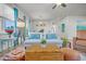 Inviting living room with a coastal theme, plush seating, and natural light at 9700 Flooded Field Drive Dr, Ladson, SC 29456
