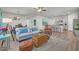 Open-concept living area with stylish decor, comfortable seating, and a view into the modern kitchen at 9700 Flooded Field Drive Dr, Ladson, SC 29456