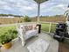 Relaxing outdoor patio with comfortable seating, waterfall feature, and a cozy fire pit at 9700 Flooded Field Drive Dr, Ladson, SC 29456