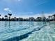 Water-level view of the community pool showing sun-drenched, crystal clear water and poolside features at 9700 Flooded Field Drive Dr, Ladson, SC 29456