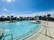 Large community pool with cabanas, umbrellas, and lounge seating on a sunny day at 9700 Flooded Field Drive Dr, Ladson, SC 29456