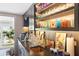 Elegant bar area with display shelving, brass sink, and stylish decor at 10 Water St, Charleston, SC 29401