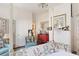 Bright bedroom featuring a four-poster bed, red dresser, and charming decor throughout at 10 Water St, Charleston, SC 29401