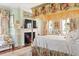 Charming bedroom featuring a canopy bed, fireplace, and ample natural light at 10 Water St, Charleston, SC 29401