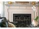 Close-up view of the fireplace featuring beautiful detailing and charming mantel decor at 10 Water St, Charleston, SC 29401