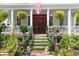 Charming front entrance with lush greenery, plants, and manicured landscaping at 10 Water St, Charleston, SC 29401