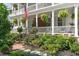 Beautiful Charleston home with a lush front garden and double porch at 10 Water St, Charleston, SC 29401