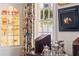 Elegant interior featuring a tea set, decorative window, and stylish floral curtains at 10 Water St, Charleston, SC 29401