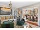 Spacious living room with chandelier that leads to a dining area and elegant decor at 10 Water St, Charleston, SC 29401