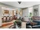 Open-concept living room with hardwood floors and views into the elegant dining area at 10 Water St, Charleston, SC 29401