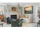 Elegant living room featuring a fireplace, chandelier, and comfortable seating area at 10 Water St, Charleston, SC 29401
