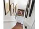 Staircase adorned with unique artwork, including a pig painting, enhancing the home's character at 10 Water St, Charleston, SC 29401