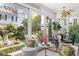 Charming sunroom with abundant natural light and picturesque garden views at 10 Water St, Charleston, SC 29401