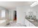 Bathroom featuring dual sinks, granite countertops, walk-in shower and soaking tub at 103 Haleswood Cir, Goose Creek, SC 29445