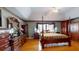 Spacious bedroom featuring a four-poster bed, hardwood floors, and plenty of natural light at 103 Haleswood Cir, Goose Creek, SC 29445