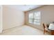 A bright bedroom features a window and neutral carpet, offering a cozy atmosphere at 103 Haleswood Cir, Goose Creek, SC 29445
