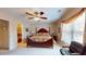 Bedroom boasts a dark wooden bed frame, plush carpet, and a window for natural light at 103 Haleswood Cir, Goose Creek, SC 29445
