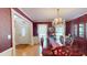 Dining room boasts a decorative chandelier and a large wooden table for entertaining guests at 103 Haleswood Cir, Goose Creek, SC 29445