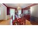 Formal dining room featuring a decorative chandelier and ample storage with wood cabinets at 103 Haleswood Cir, Goose Creek, SC 29445
