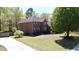 A charming two-story brick home with a well-manicured lawn and established landscaping at 103 Haleswood Cir, Goose Creek, SC 29445
