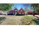 Charming two-story brick home with blue shutters and a well-manicured lawn at 103 Haleswood Cir, Goose Creek, SC 29445