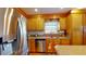 Bright kitchen with stainless steel appliances, wood cabinets, and granite countertops at 103 Haleswood Cir, Goose Creek, SC 29445