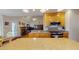 Open-concept kitchen boasts granite countertops, stainless steel appliances, and a vaulted ceiling at 103 Haleswood Cir, Goose Creek, SC 29445